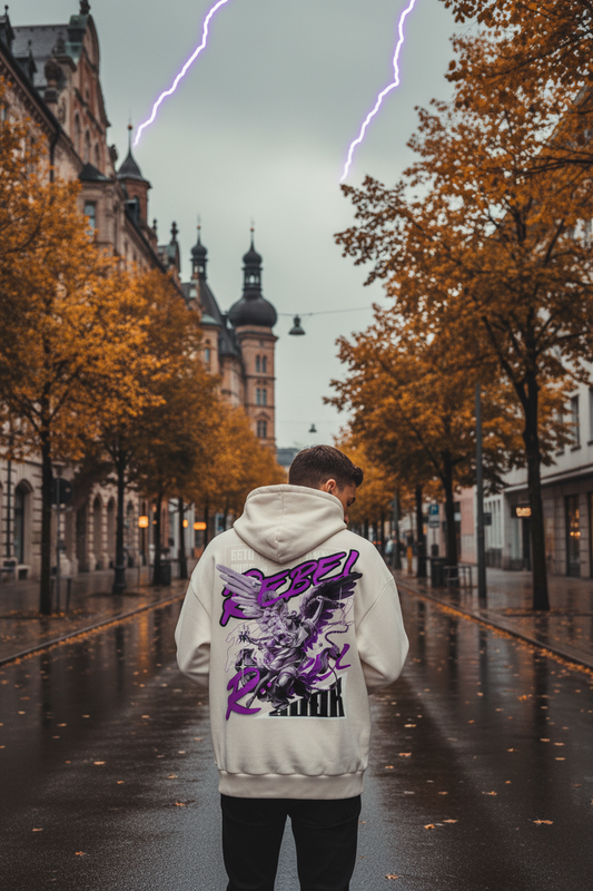 SUÐR VESTR REBEL – Hoodie in Creme mit Rückenprint „Rebel“ und Engelsmotiv in Lila